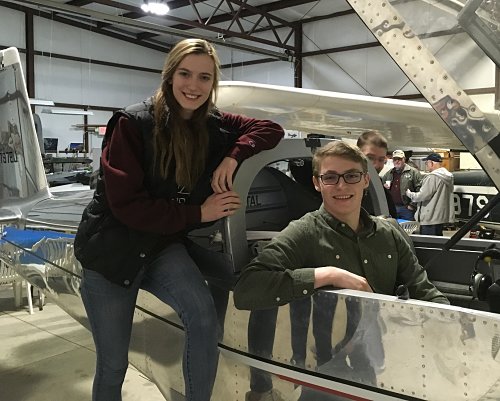 kids receiving r/c airplane